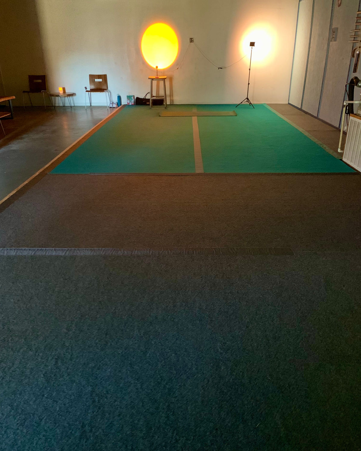 The Just Move Fitness Mat Pilates studio in Weatherford, softly lit and ready for class